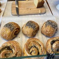 Orange cake with white chocolate, seitan roll and pesto roll: all tasty but the seitan roll is the best! at Loaf Sourdough Bakery in Utrecht