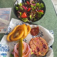 Berry salad, onion rings, and chickpea burger at Great Turtle Brewery and Distillery in Mackinac Island