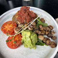 Quinoa fritters with mushrooms, avo & tomato  at Claire's Wholesome Kitchen in Springfield Central