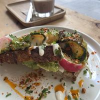 Avocado Toast with grilled mushrooms and an iced chocolate for 13,80 EUR  at NEØ Coffee House in Barcelona