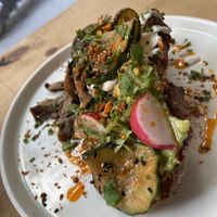 Avocado toast with grilled mushrooms  at NEØ Coffee House in Barcelona