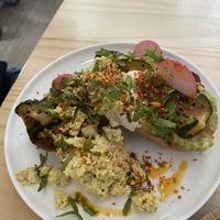 Tostada avocado and scrambled tofu  at NEØ Coffee House in Barcelona