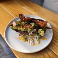 Avocado Toast with vegan bacon and cucumber kimchi at NEØ Coffee House in Barcelona
