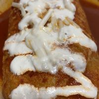 “Beef” wet burrito with red sauce. Amazing!  at SoyMexican in Las Vegas