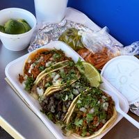 A collection of tacos, Hibiscus water, avocado, and sauces  at SoyMexican in Las Vegas