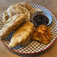Mongolian dumplings above, Russian ones below, kimchi  at Veganaa in Berlin