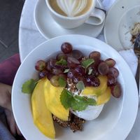 Greek yoghurt with yummy toppings and cappuccino   at À la Lo in Stockholm