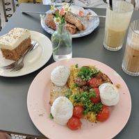 Scrambled tofu toast, carrot cake, french toast, iced latte and mango lassi. at À la Lo in Stockholm