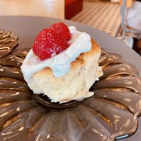 Cinnabun with cream cheese topping and fresh strawberries  at À la Lo in Stockholm