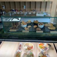 View from inside the shop with bowls, salads and baked goods at WholeLifeGo in Calgary