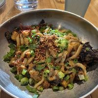 Spicy Szechuan noodles ft. udon noods, baby corn, wood ear mushrooms, green onions, + saffron  at ima - Midtown in Detroit