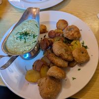 Vegan schnitzel with potatoes and green sauce at Zum Eichkatzerl in Frankfurt