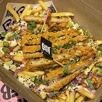 Iconic rainbow fries at Vegan Junk Food Bar - El Born in Barcelona