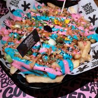 Iconic rainbow fries at Vegan Junk Food Bar - El Born in Barcelona