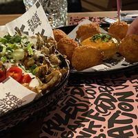 Mac and cheeze balls with loaded fries at Vegan Junk Food Bar - El Born in Barcelona