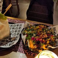 Kapsalon and coconut cocktail at Vegan Junk Food Bar - El Born in Barcelona