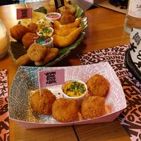 Kroquette and fish platter in the back. at Vegan Junk Food Bar - El Born in Barcelona