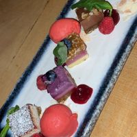 Amazing dessert, the flavors were: coconut with chocolate, raspberry with passion fruit, blueberry with date, hazelnut chocolate. And some raspberry sorbet icecream 😍 at De Buurman in Heerenveen