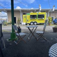 Outdoor covered seating area  at Tabaraka in Hilo