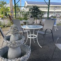 Cute outdoor seating area (covered)  at Tabaraka in Hilo