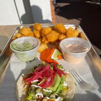 Veggie taco - two dips for tator tots (though one is buttermilk) so really just one dip. at Taco Daddy's in Martinez