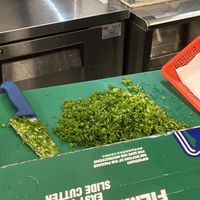 Chopping green onions fresh in store   at Soulmate Ramen 素味謀麵 in Hong Kong Island