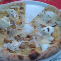 Black truffle pizza with vegan mozzarella. at Giardino in Bellinzona