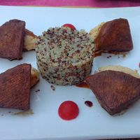 Tofu wedges with humus and quinoa. at Giardino in Bellinzona