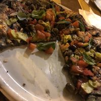 Pizza with special roasted dough  at Oasi La Pizza in Imperia