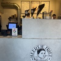 Front counter with serving sizes  at Heertje Friet in Amsterdam
