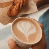 Cappucino and cinnamon pastry at WAY Specialty Coffee Roasters in Ghent