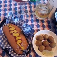 Deep fried olives filled w/cashew cheese, vegan hot dog at Woof! in Dunedin