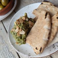 Roast garlic, Dill, Almond & Preserved Lemon Hummus, with hot pita bread at The Punter in Oxford