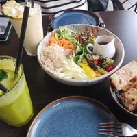 Detox juice, Pina colada smoothie, vegan bowl, bread on the side at Juicy Skagen in Skagen