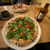 Pizza verde with fresh tomatoes and baby spinach.  at Pizza i Gitara in Bydgoszcz