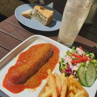 Seitan Currywurst  / Zitronen-Mohn Kuchen at Cafe Riptide in Braunschweig