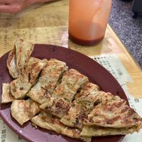 Thai basil flaky savory pancake (九層塔抓餅) at Nán Tún SùShí Shuǐ Jiān Bāo 南屯素食水煎包 in Taichung
