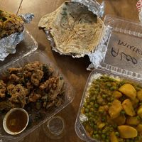 Vegetable pakora, garlic naan, vegetable wrap, and aloo mutter. (I already ate some of the wrap and picked at the naan before snapping the photo, lol!) at Taste of India in Rockaway Beach