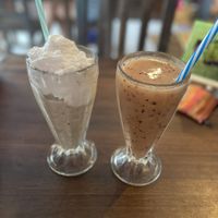 Smoothie with fruits of the season and “Chunky Monkey” Milkshake (homemade peanut butter and chocolate)  at Sol de Maple in Cozumel