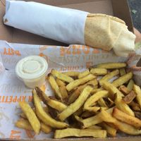 Falafel sandwich with chips and tahini sauce at Les Délices du Liban in Montpellier