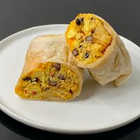 breakfast burrito (cut in half + plated at home) at Central Cafe and Juice Bar in Seattle