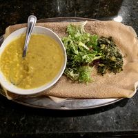 Kik Alicha with collards. Also comes with a side of injera.  at Demera in Chicago