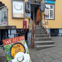 Exterior, with some outdoor seating on the other side of the building at Mama  in Reykjavik