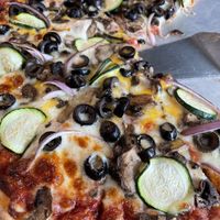 Vegan cheese custom veggie including zucchini! 😋  at Rafferty's Pizza in Crosby