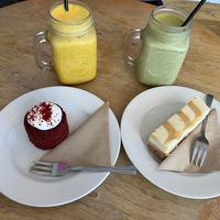 Delicious red velvet cake, salted caramel cheesecake and an iced matcha and turmeric latte. at Thrive in Cambridge