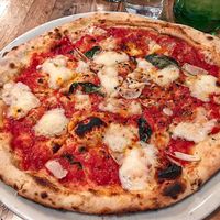 Saucy pizza. Paper thin, random plops of cheese and not many toppings.  at Fireflour Pizzeria in Bismarck