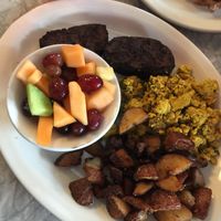 Tofu scramble breakfast with potatoes, fruit, and vegan sausage - delicousss at 821 Cafe in Richmond