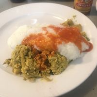 Tofu scramble topped with grits and hot sauce (I forgot to take a photo before I doctored the meal lol) at 821 Cafe in Richmond