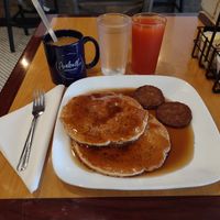 Really yummy vegan pancakes, vegan sausages, grapefruit juice, coffee, & oat milk! at Arabella in Hendersonville