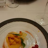 Aquafaba pavlova, peach from the market, pear sorbet at Le Courage in Maastricht